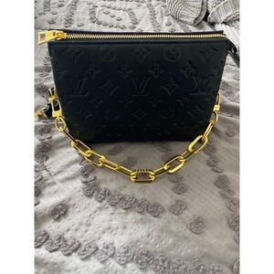 Black purse with gold chain